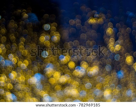 Abstract multicolor bokeh lights effect background, blue and yellow lights