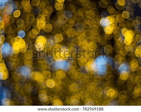 Abstract multicolor bokeh lights effect background, blue and yellow lights
