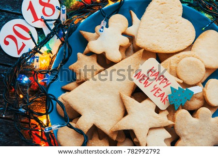 Plate with tasty holiday Gingerbread Cookies - Happy New Year card
