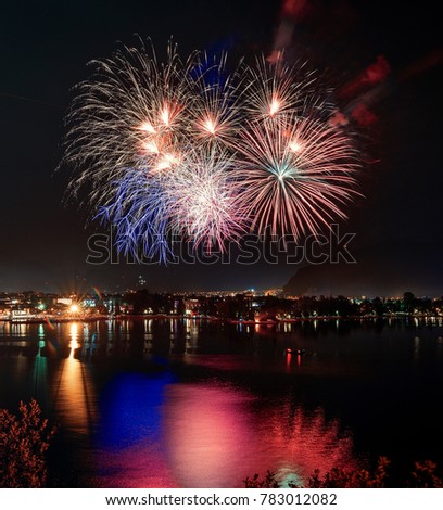 Beautiful firework display for celebration on the Grda Lake,italy,Brightly Colorful Fireworks