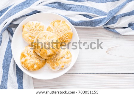 Homemade apple pie in asian style on wood background