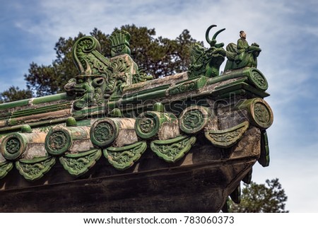 Historic Chinese Imperial Roof Decorations. Decorative Ceramic Charms on Traditional Chinese Building (Beijing, China).