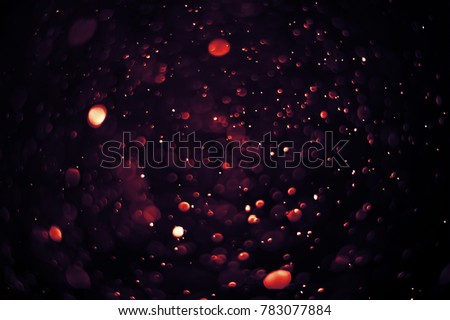 Light and flare in dark tones bokeh abstract background with cop