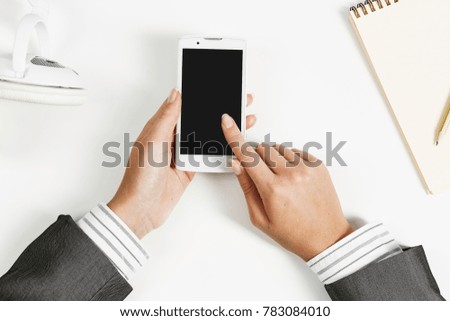 Businesswoman using her smartphone