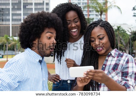 Group of african american people looking at phone