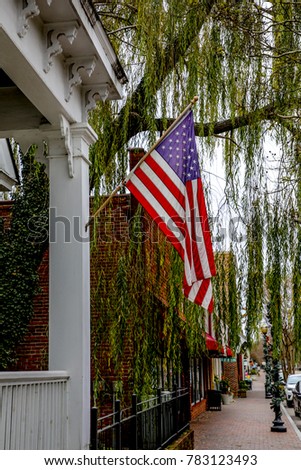 us flag on porch Royalty-Free Stock Photo #783123493