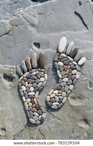 Human footprints in stone