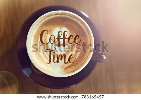 Top view image of coffee cup on wooden desk with text. Coffee Time. Flat lay. 