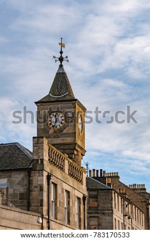 A clock tower on a historical building in Stockbrige, Edinburgh