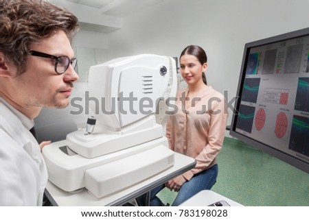 Ophthalmologist in eyes clinic  examine Retinal Visual Function with a OCT SLO machine Royalty-Free Stock Photo #783198028