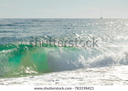 photo of a wave on the beach
