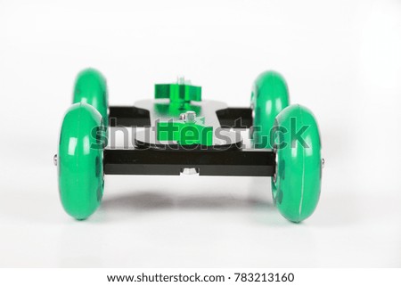 Roller tripod for camera on white background.