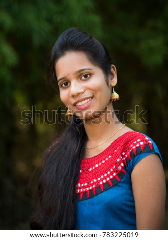 Outdoors portrait of beautiful young Indian girl.
