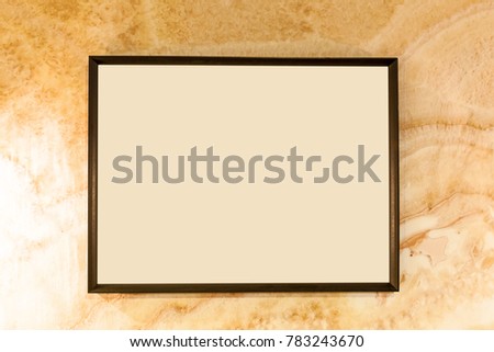 Blank photo frames on wall.Aged wall texture with blank photo frame