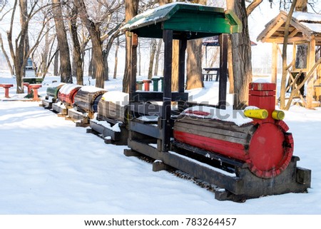 Abandoned kid's playground lost in snows of the winter farm in Serbia