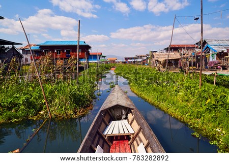 Boat on the Inle lake in city on the water in Burma, Burma,  Myanmar.  Royalty-Free Stock Photo #783282892