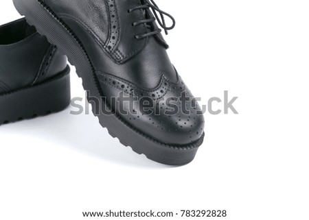 Female black leather elegant shoe on white background, isolated product, comfortable footwear.