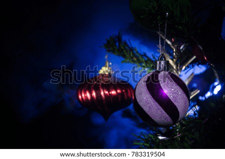 Christmas Toy on the Christmas tree. New Year ornaments winter background for postcard empty space. New Year eve background - glass Christmas toy. Greeting card. Selective focus