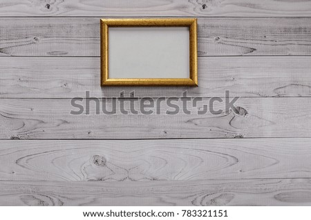 Frame for photography on a light, vintage wooden background