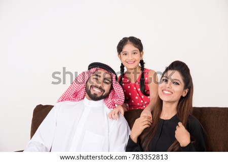 Arab family happy at home sitting on sofa chair with white background