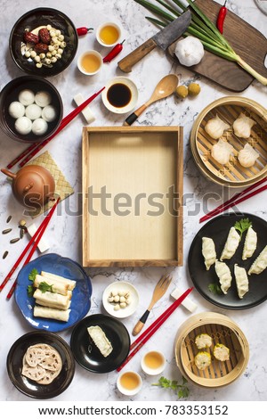Flat lay Chinese new year food and drink on marble table top. Text space image.