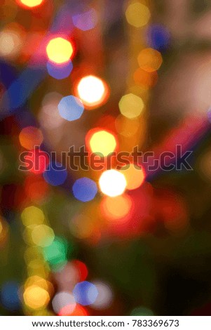 Bokeh effect on the colored lights on a Christmas tree