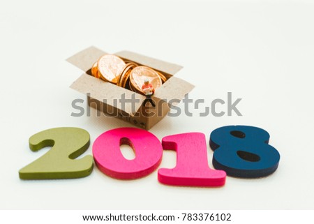 Miniature people, woman sitting on box contain stack coin using as business, finance, bangking concept in year 2018 - Vintage filter