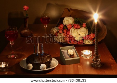 
Festive table with cake, flowers and clock