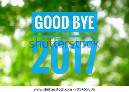 word "good bye 2017" written on blur image of lights.Visible noise due to high ISO