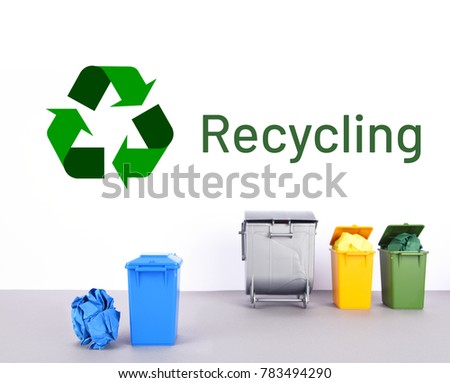 Colorful recycle bins on white and gray background. Recycling concept.