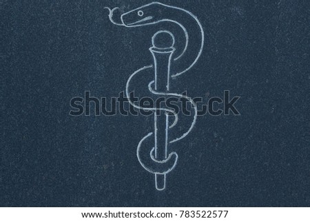 Asclepius Rod on stone surface (symbol of health, medicine and eternal life)