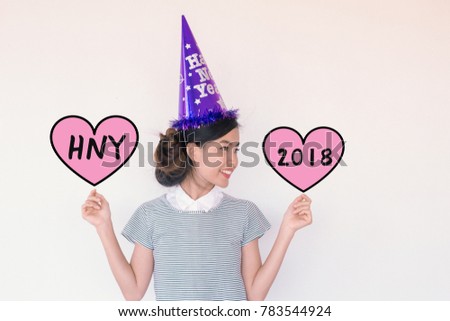 Young cute asian woman wearing Happy New Year's Eve Party Hat