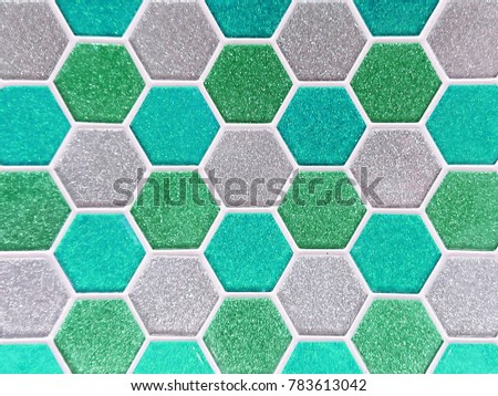 Closeup Texture of Colorful Acrylic Tiles in Green/ Cyan Shade with Hexagonal or Beehive Shape for Wall, Floor, Interior Works, Background