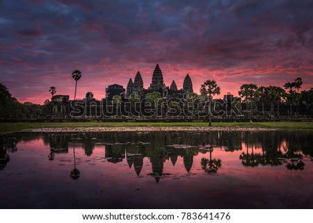 Beautiful sunrise with colorful sky at Angkor Wat (means "Temple City), a world heritage site, a temple complex in Siem Reap, Cambodia, the largest religious monument and the 7th wonder of the world.