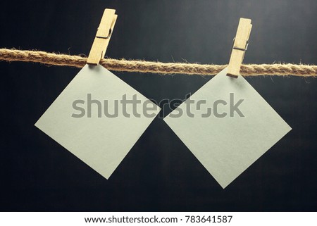 Blank note paper hanging on rope