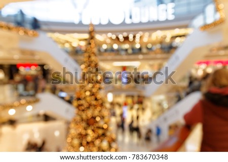 Christmas Trade and Shopping in multi-story Shopping Mall blurred background