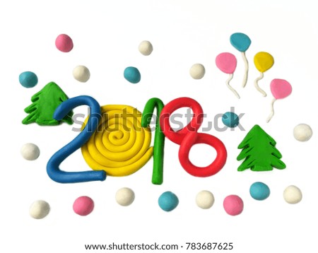 Colorful plasticine clay handmade are beautiful numbers year 2018,a number 0 creates roll shape decorated a green tree, balloons and snow covered on a white background,celebrating new year dough