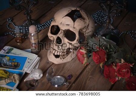 Helloween. Mystic still life with skull, tarot cards, books and candles