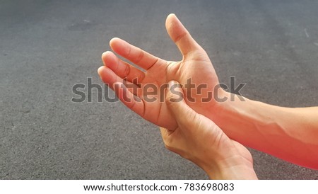 Hand of a man pressing pain, healthy and medical concept.