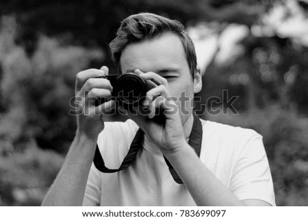 young man taking photograph 