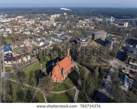 Aerial view over Church of Saint Mary's Scapular in resort city Druskininkai, Lithuania. During early spring daytime. 
