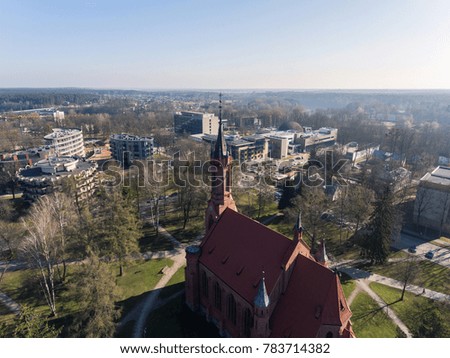 Aerial view over Church of Saint Mary's Scapular in resort city Druskininkai, Lithuania. During early spring daytime. 
