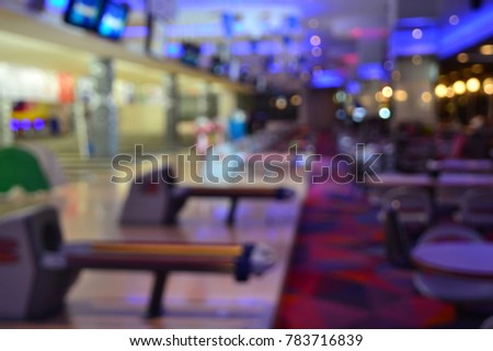 Blur of  bowling alley lane with balls return machine.