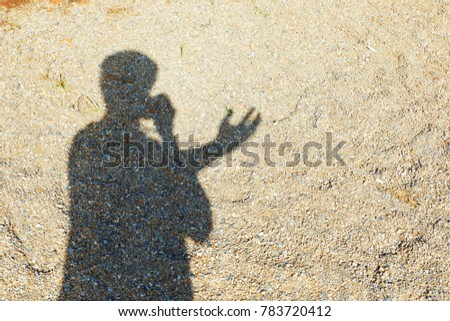 Man's silhouette in various gestures On the sand texture.