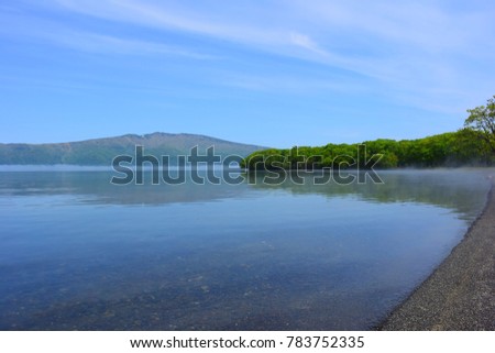 Beautiful blue lake with reflection in Hokkaido, Japan  (Lake Kussyaro in Akan national park)