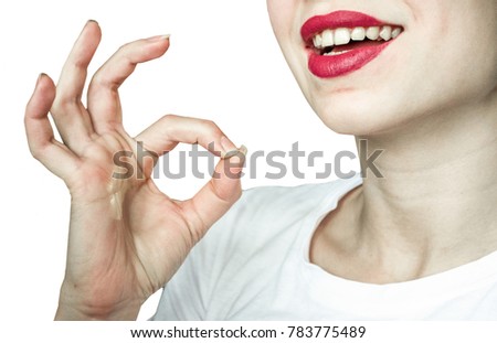 Happy smiling beautiful young woman showing okay gesture