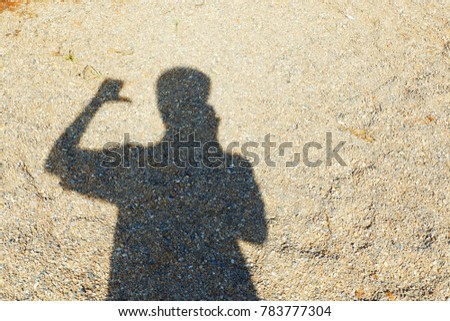 Man's silhouette in various gestures On the sand texture.