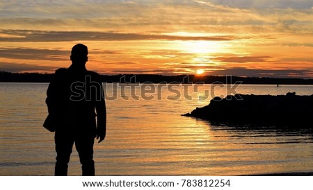 Person enjoying the sunset and the shoot