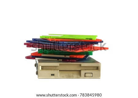 Floppy disk drive and diskettes on white background, old technology and legacy industrial computer equipment