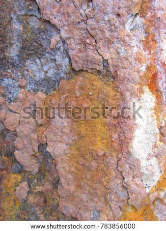 Old and decayed metal structure showing heavy flaking rust and corrosion. Colours